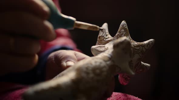 Closeup Woman Hands Decorating Product in Pottery