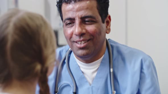 Doctor Checking Throat of Little Girl