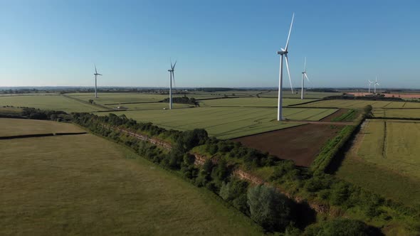 Aerial View Over Old Disused Limestone Opencast Mine And Wind Turbine Farm Northamptonshire