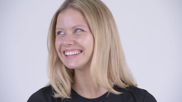 Face of Young Happy Blonde Woman Smiling and Laughing
