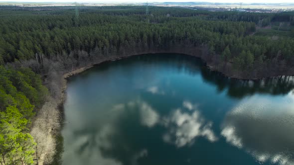 Drone flying above hidden lake with heart silhouette in Mazury region, north Europe. Aerial Concept