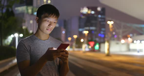 Man use of smart phone at night