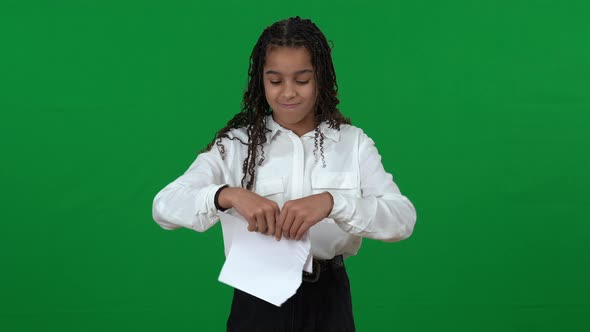 Stressed Angry Teen Girl Tearing Paper on Green Screen Crossing Hands