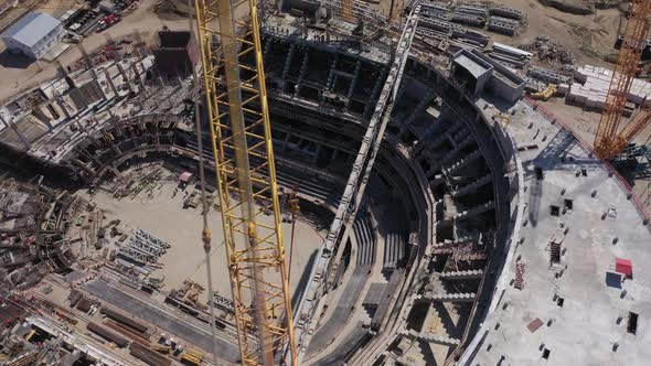 Machine Carries Detail of Roof Frame at Arena Building