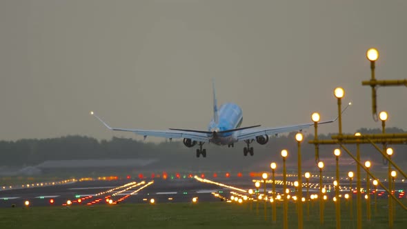 Airplane Landing in the Background of Landing Lights