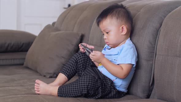 Little Boy Using Smartphone