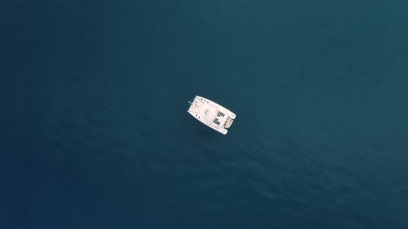 Vertical of an anchored catamaran boat