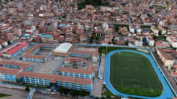 Aerial View Of Inca Garcilaso de la Vega College And Stadium In Cusco, Peru - drone shot