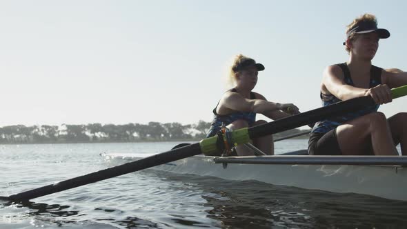 Female rowers training on a river