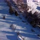 Aerial Shot Detail of a Small Village Among Trees Winter Wooded Mountain Landscape - VideoHive Item for Sale