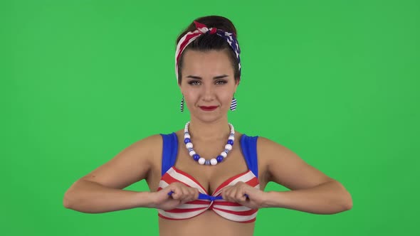 Portrait of Beautiful Girl in a Swimsuit Is Posing at Camera. Green Screen