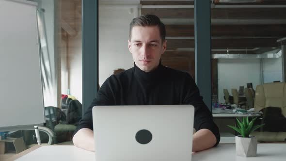 Portrait of Business Man Entrepreneur Typing on Laptop