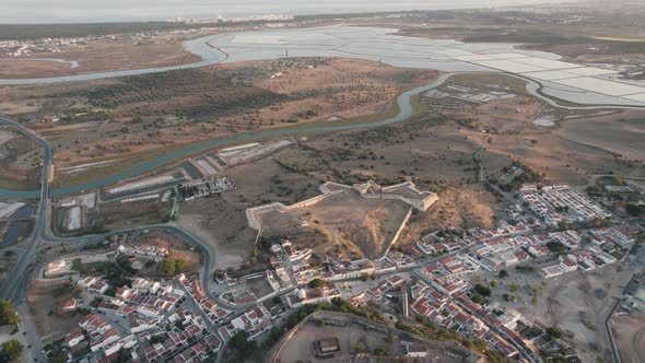 Birdseye view of Forte de São Sebastião and salt pans around parish town Castro Marim.