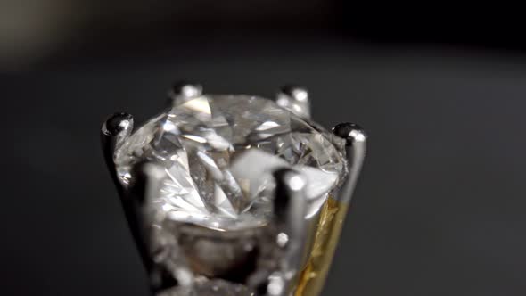 Extreme Detailed of Diamond Ring Close Up Shot While Rotating on Dark Background