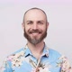 Portrait of a smiling man wearing hawaiian shirt over white background. - VideoHive Item for Sale