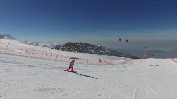 Aerial Snowboarder On The Slope