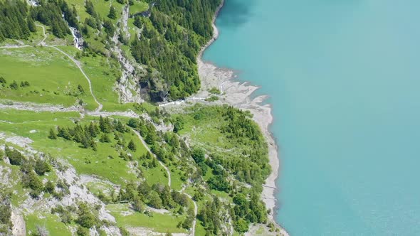 Aerial of beautiful green shoreline near a beautiful lake