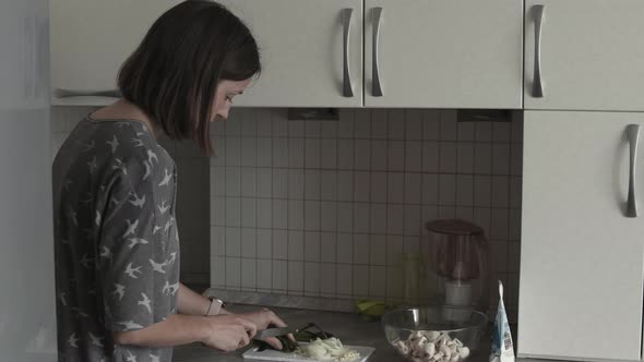 Woman Preparing Dinner At Kitchen