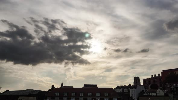 Time lapse of sun descending in sky over Bristol skyline