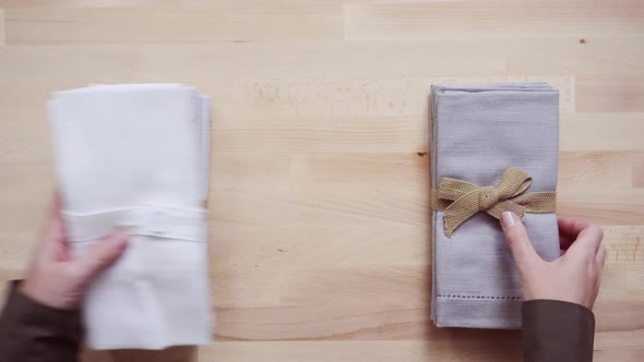 New linen dinner napkin on wood table.