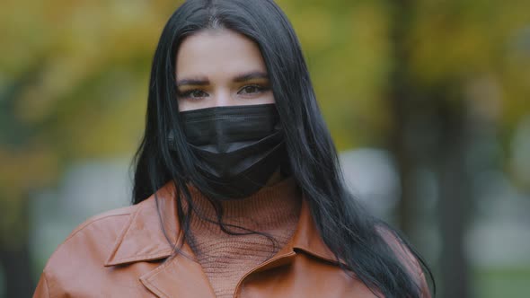 Portrait Beautiful Young Hispanic Woman in Protective Medical Mask Standing Outdoors Looking at