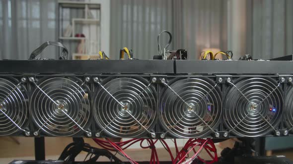 Close Up Of Cryptocurrency Mining Rig Working On The Table