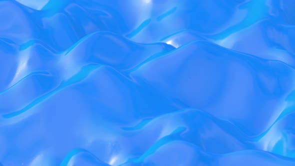 Melting Glossy Coated Blue Plastic Liquid Surface Waves Background