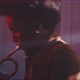 A trumpeter intensely playing in a room with smoke and red neon light - VideoHive Item for Sale