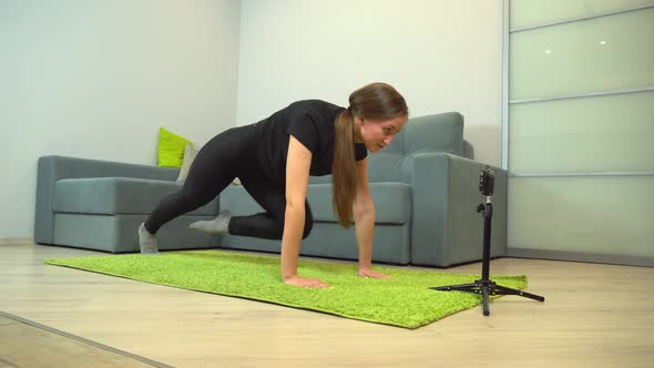 fitness exercises, home sports. An instructor-blogger does sports on camera.