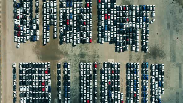 Drone Flying Over Cars Parked at a Car Dealer Parking Lot.