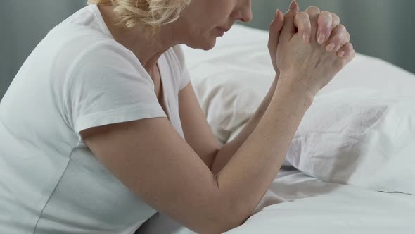 Aged Woman Praying at Her Bed, Religious Values and Convictions, Faith in God