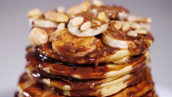 Pancakes with Chocolate, Cacao, Nuts and Bananas. Tasty Breakfast, Food.