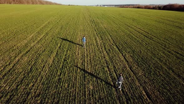 Aerial View Young Brothers Running 