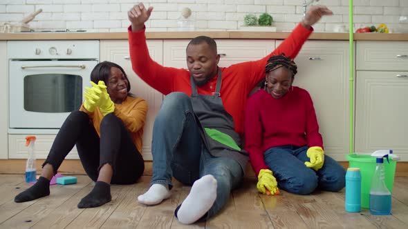 Cheerful Single Parent Family Embracing After Housework