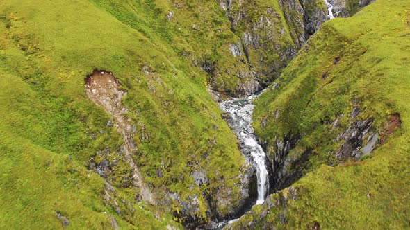 Aerial view of a waterfall in Anderson Bay, Unalaska, Alaska, United States.