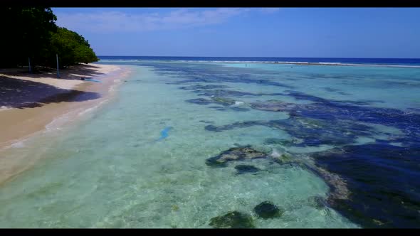 Aerial drone view scenery of perfect bay beach voyage by transparent water with white sandy backgrou
