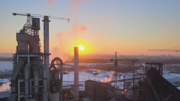 Aerial View of Cement Factory with High Concrete Plant Structure and Tower Crane at Industrial