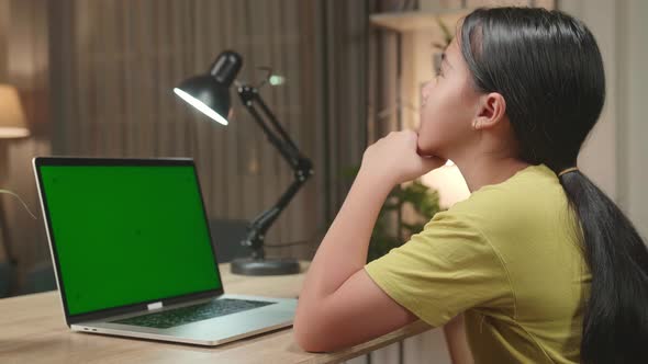 Asian Kid Girl Sitting Use Laptop Computer And Thinking Then Raising Her Index Finger