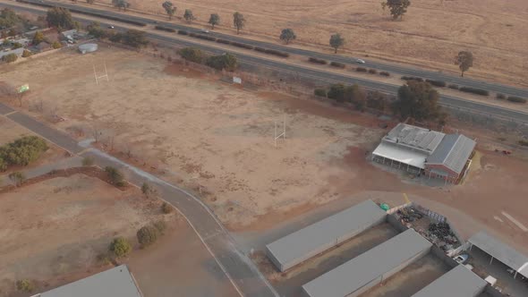 AERIAL shot over a school next to a national road during winter