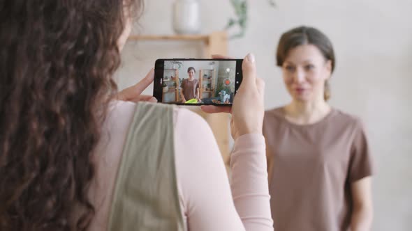 Filming Woman Making DIY Cosmetics