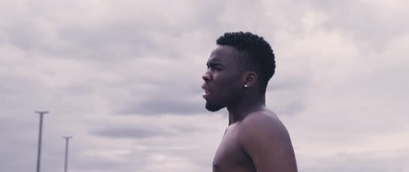 Motivated black man on rooftop