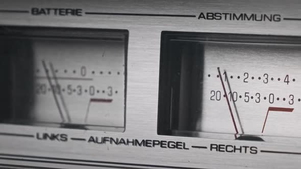 Two Analog VU Meters on Silver Colored Tape Recorder Arrow Indicators