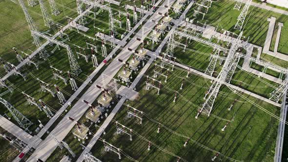 Power plant with tall pylons and voltage distribution cables.