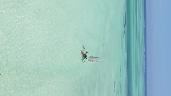 Vertical Video Boats in the Ocean Near the Coast of Zanzibar Tanzania Aerial View