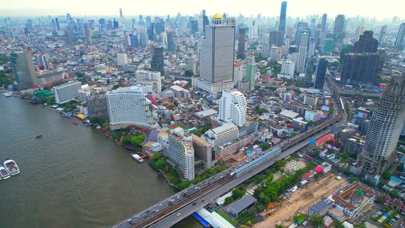 4K UHD : Aerial view over the Chao Phraya River and Buildings of Bangkok