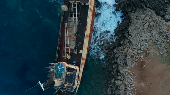 Abandoned Boat Stranded on Shore of Mediterranean Sea, Top View