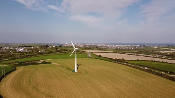 Wind turbine amidst green countryside in the UK 2