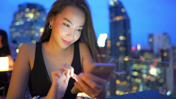 Young asian woman use smart phone