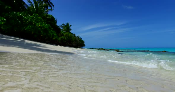 Luxury above tourism shot of a summer white paradise sand beach and aqua blue water background in vi