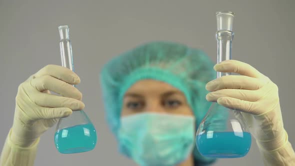 Medical Researcher Holding in Hands Test Tubes With Liquid